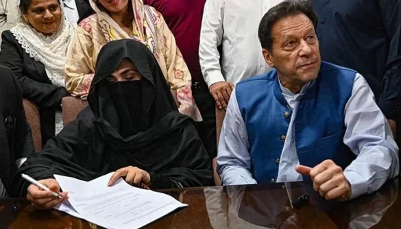 PTI Chairman Imran Khan (right) along with his wife Bushra Bibi